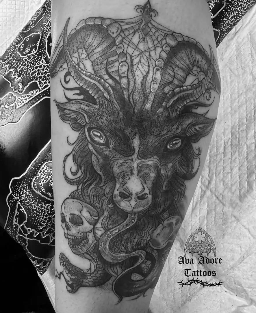 Baphomet goat head with ribbed horns, a webbed crest, a skull and coiled serpent